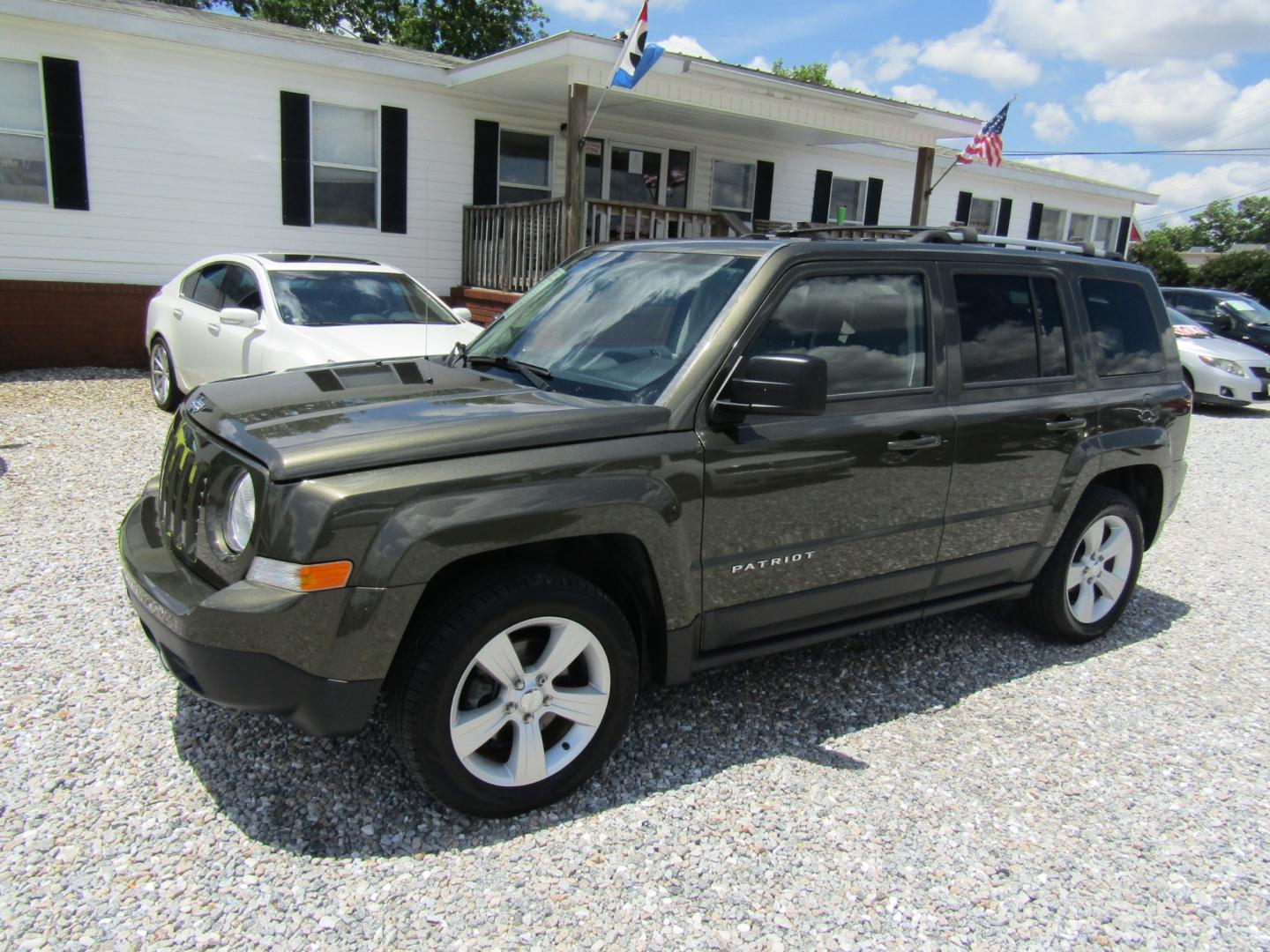 2015 Green /Tan Jeep Patriot (1C4NJPCB2FD) with an 4 CYL engine, Automatic transmission, located at 15016 S Hwy 231, Midland City, AL, 36350, (334) 983-3001, 31.306210, -85.495277 - Photo#2